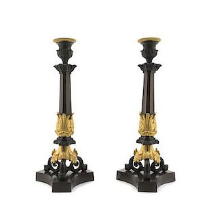 A Pair of French Empire Gilt and Patinated Bronze Candlesticks, Height 11 3/4 inches.