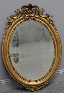 Antique Oval Giltwood Mirror with Carved Crown
