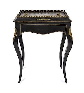 A Napoleon III Gilt Metal Mounted Ebonized Jardiniere Stand, Height 28 1/2 x width 21 1/8 x depth 13 3/4 inches.