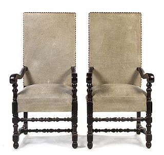 A Pair of Henry II Style Oversized Ebonized Open Armchairs, Height 55 1/2 inches.