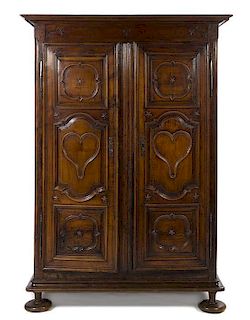 A French Provincial Walnut Armoire, Height 79 x width 56 1/4 x depth 26 1/2 inches.
