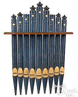 Nine painted wood organ pipes