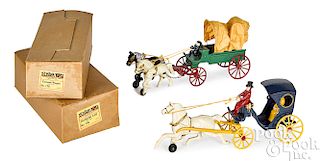 Two Kenton cast iron horse drawn wagons