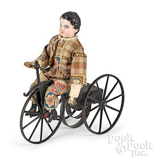 Composition boy riding clockwork velocipede