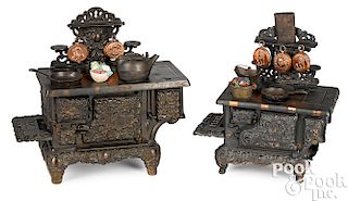 Two cast iron child's toy stoves
