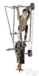 Gunthermann painted tin wind-up flying acrobat toy