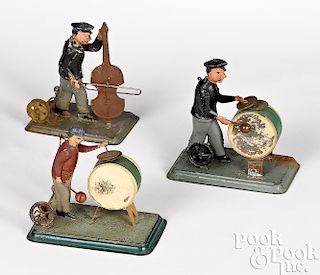 Three painted tin musician steam toy accessories