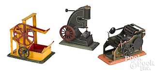 Three Bing painted tin machine steam toy accessories