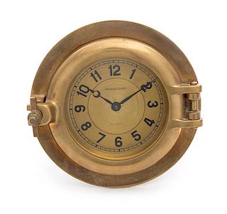 A Swiss Brass Ship's Clock Diameter 6 1/2 inches.