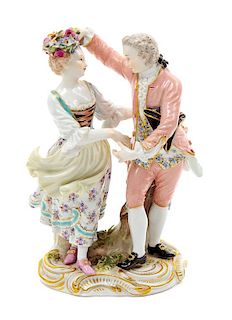 * A Meissen Porcelain Figural Group Height 6 inches.