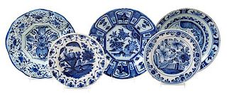 Five Delft Pottery Chargers Diameter of largest 11 7/8 inches.
