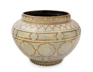 A Middle Eastern Brass Jardiniere Height 9 1/2 x diameter 13 1/4 inches.