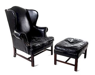 A Georgian Style Wingback Armchair and Ottoman Height of armchair 49 1/2 inches.