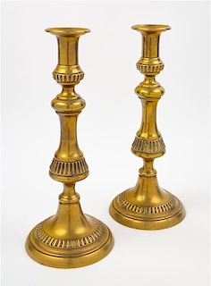 A Pair of English Brass Candlesticks Height 12 1/4 inches.