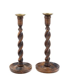 A Pair of English Oak Candlesticks Height 12 1/4 inches.