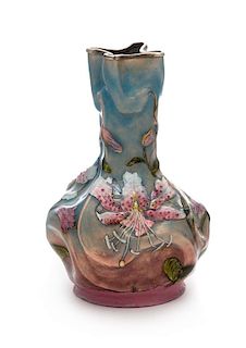 A French Enameled Silver Vase, Maker's Mark Obscured, 20th Century, of undulating baluster form, worked to show polychrome flora