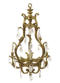 A Louis XV Style Gilt Bronze and Rock Crystal Three-Light Chandelier, Height 32 x diameter 19 inches.