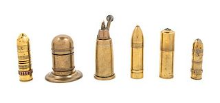 A Group of Six Brass Cigarette Lighters Height of tallest 4 1/2 inches.