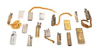 A Collection of Fourteen Mixed Metal Cigarette Lighters Height of tallest 3 1/2 inches.