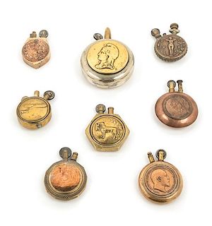 A Group of Eight Mixed Metal Circular Pocket Lighters Diameter of largest 2 1/2 inches.