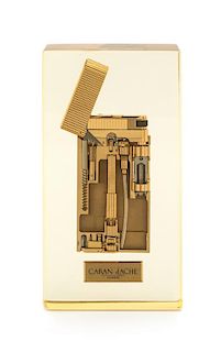 A Caran d'Ache Lucite Encased Lighter Height 4 3/4 inches.
