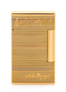 An S.T. Dupont Mozart: Requiem Limited Edition Line 2 Pocket Lighter Height 2 1/2 inches.