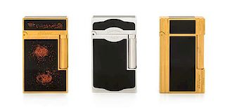 Three S.T. Dupont Line 2 Lacquered Pocket Lighters Height 2 1/2 inches.