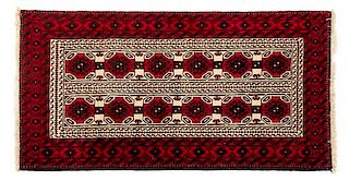 A Bokhara Wool Rug 5 feet 10 1/2 inches x 3 feet 2 1/2 inches.