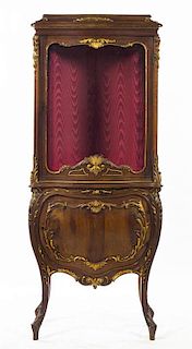 A Louis XV Style Walnut and Parcel Gilt Vitrine, Height 67 x width 27 3/4 x depth 14 inches.