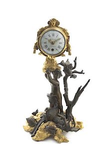 A French Gilt and Patinated Bronze Figural Mantel Clock, Height 11 1/4 inches.