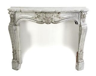A Louis XVI Style Carved Marble Fireplace Surround, Width 52 1/2 inches.