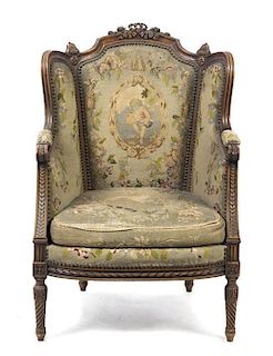 A Louis XVI Style Mahogany Bergere a Oreilles, Height 41 1/2 inches.