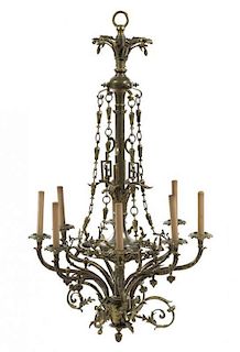 A Neoclassical Style Gilt Bronze and Brass Eight-Light Chandelier, Height from coronna 41 x diameter 25 inches.