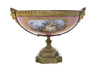 A Sevres Style Gilt Metal Mounted Porcelain Center Bowl, Width over handles 13 7/8 inches.