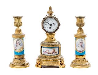 A Sevres Style Gilt Metal Mounted Porcelain Clock Garniture, Height of first 8 3/4 inches.
