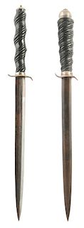 Two Similar Daggers with Carved Wood Grips