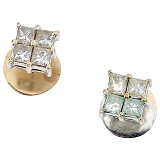 A diamonds 14K white gold pair of stud earrings.