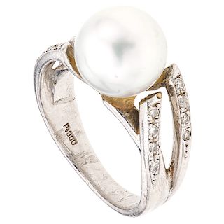 A cultured pearl and diamond platinum ring.