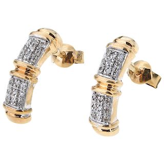 A diamond 14K yellow gold pair of earrings.