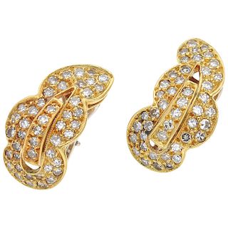 A diamond 18K yellow and white gold pair of earrings.