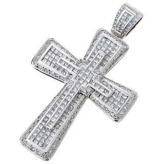A diamond 18K white gold cross pendant.