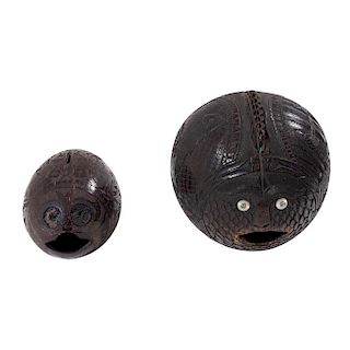 A PAIR OF CARVED COCONUT MONEYBOXES