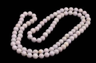 A STRAND OF NINETY-FOUR LAVENDER JADE BEADS