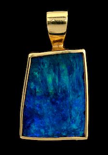 AN 18K GOLD AND OPAL PENDANT SIGNED MICKY ROOF