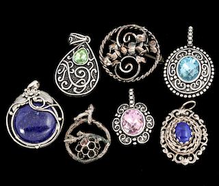 AN ESTATE COLLECTION OF SILVER PENDANTS
