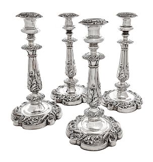 A Set of Four Silver-Plate Candlesticks Height 11 1/2 inches.