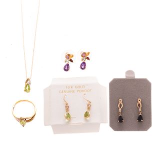 A Collection of Colored Gemstone Jewelry in Gold