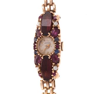 A Lucien Piccard Gemstone Cocktail Watch in Gold