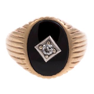 A Gent's Oval Black Onyx & Diamond Ring in Gold