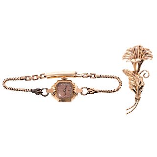 A Ladies Gold Bulova Watch & Flower Pin